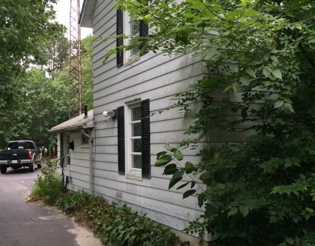close up of original white siding in maryland