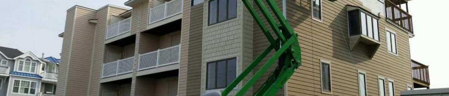 Installing siding onto a commercial apartment complex